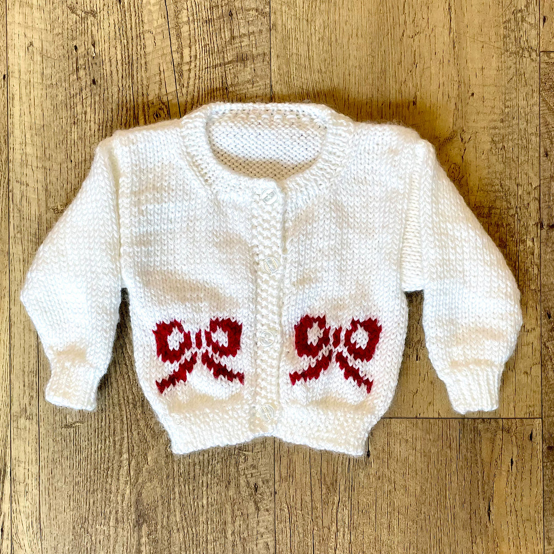 Hand Knit White Cardigan with Red Bow Design