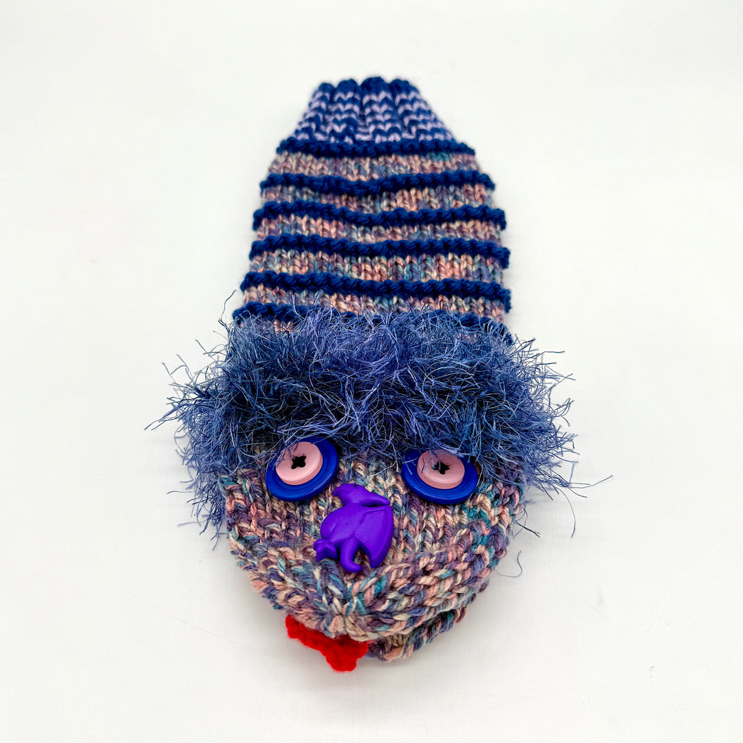 Hand knit sock puppet with blue stipes and a dinosaur nose