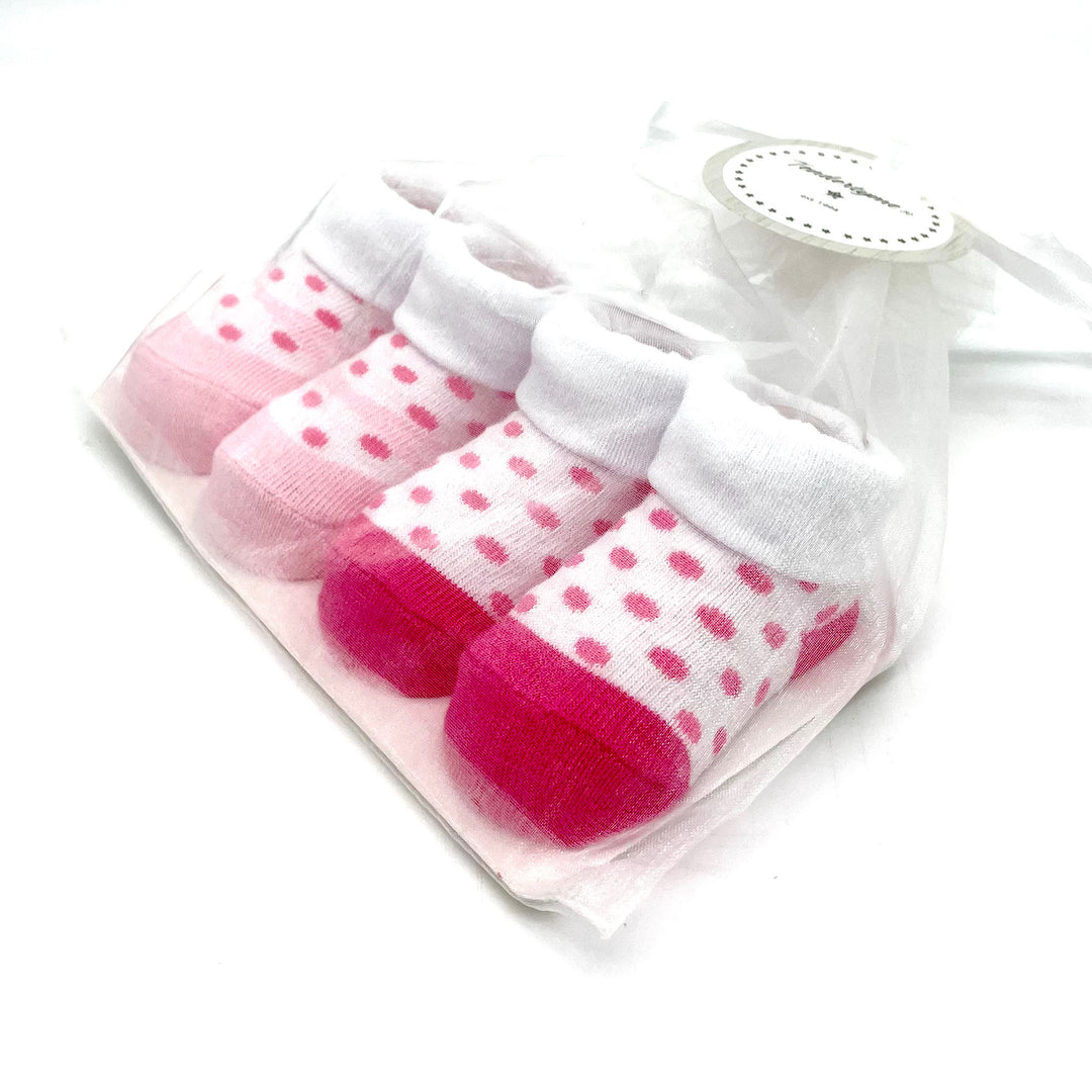 Two Sets of Pink and White Infant Socks