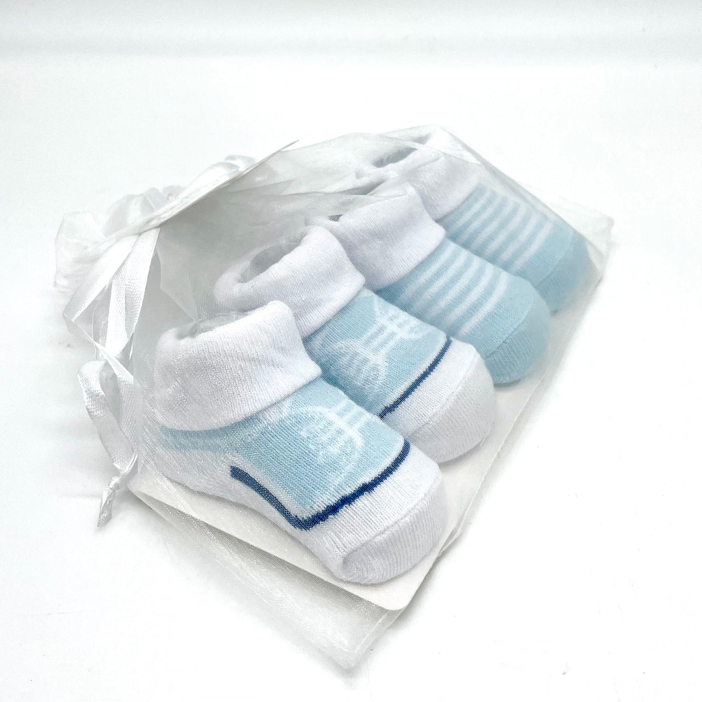 Two Sets of Blue and White Infant Socks
